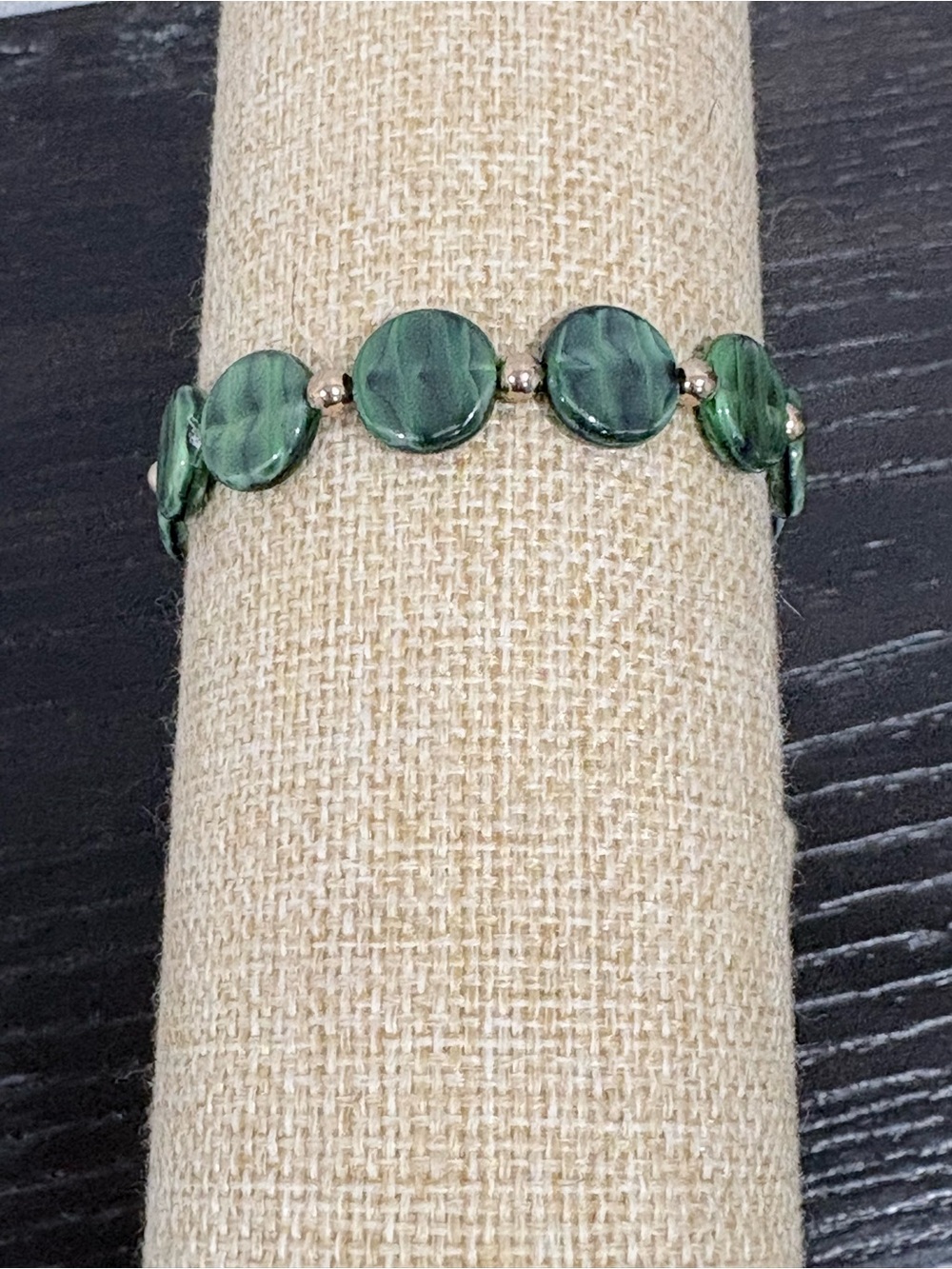 Handcrafted green round Czech glass bead with gold accents